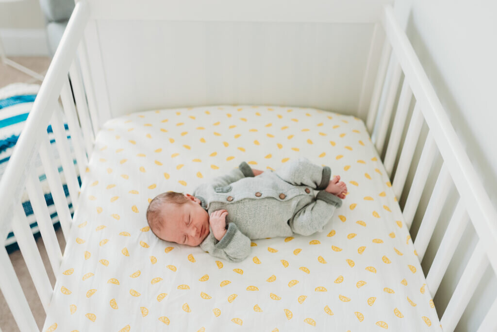newborn in crib