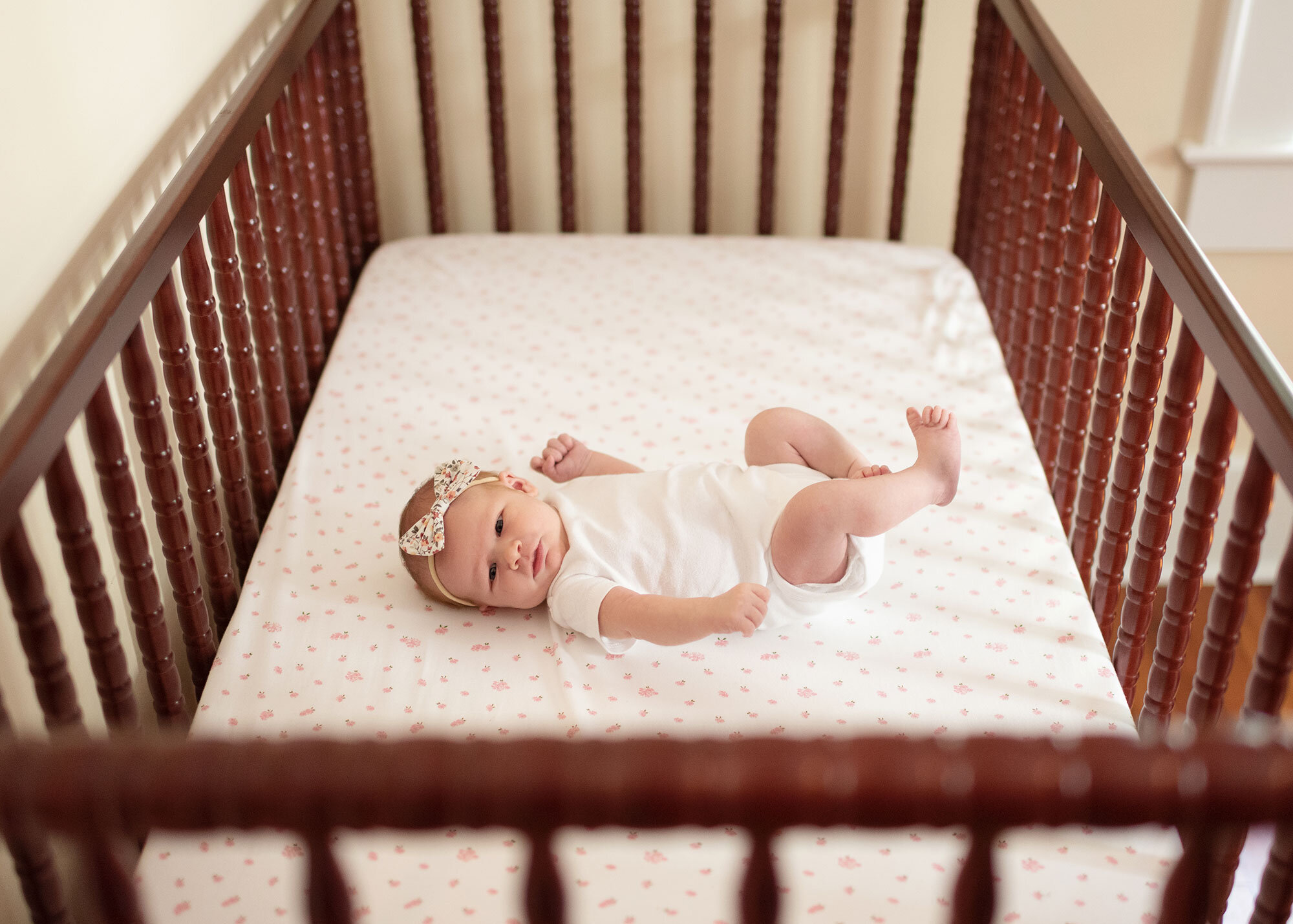 baby girl in her crib