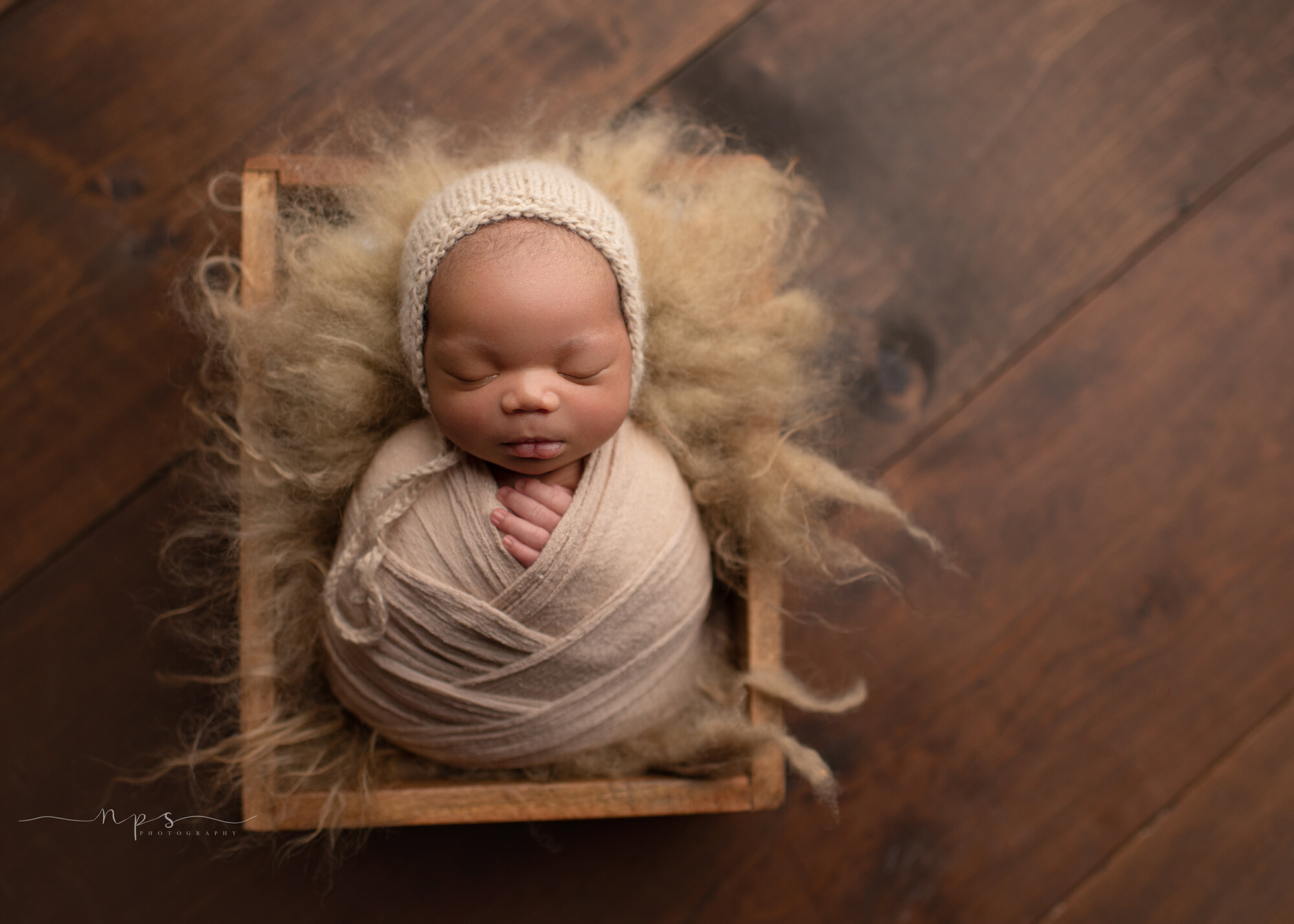 newborn pose in a crate
