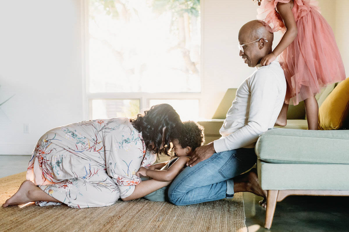 Why Parents Should Be in Family Photos | DC In-Home Photographer - NPS Photography golden hour light with family playing in a living room