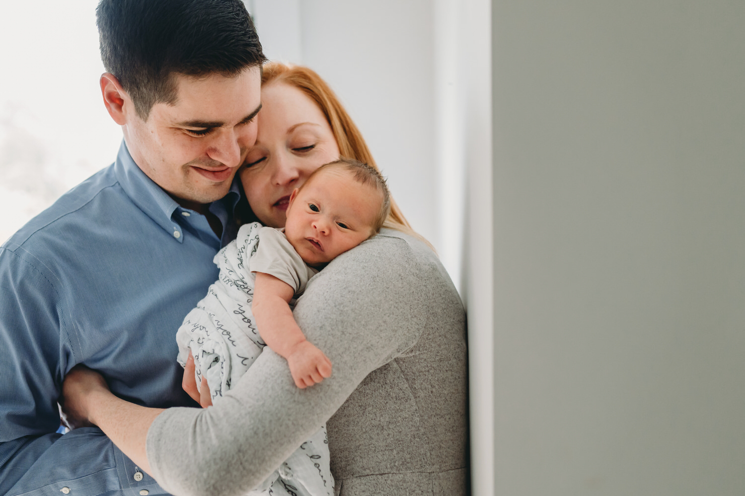 Parents holding a newborn baby in Washington DC