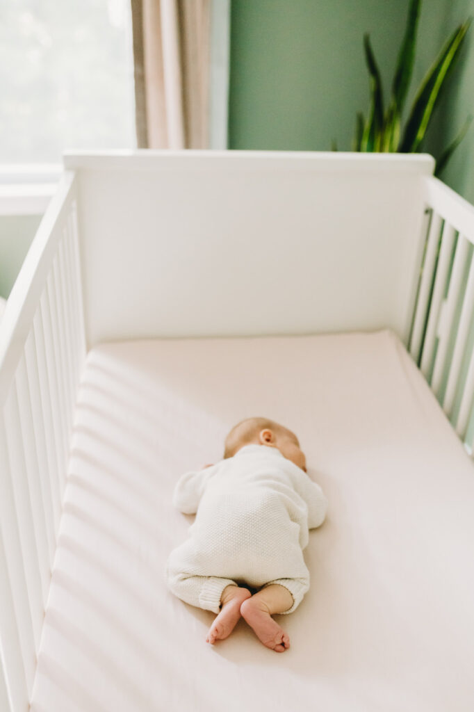 baby asleep in crib photographed by NPS Photography