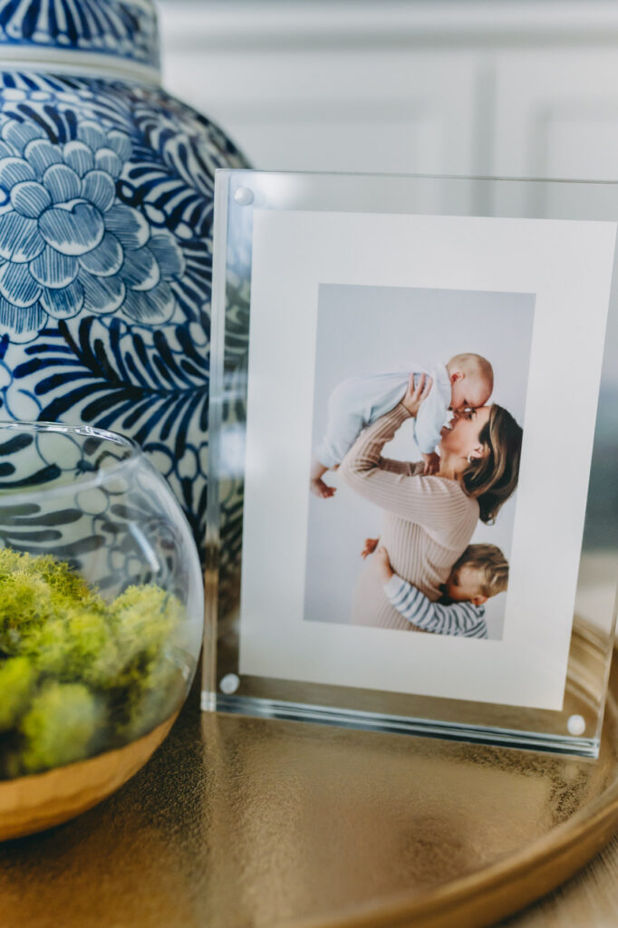 picture frame on a table with photo of mom and kids