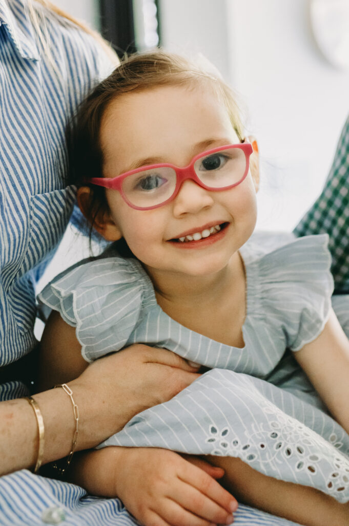 little girl with glasses