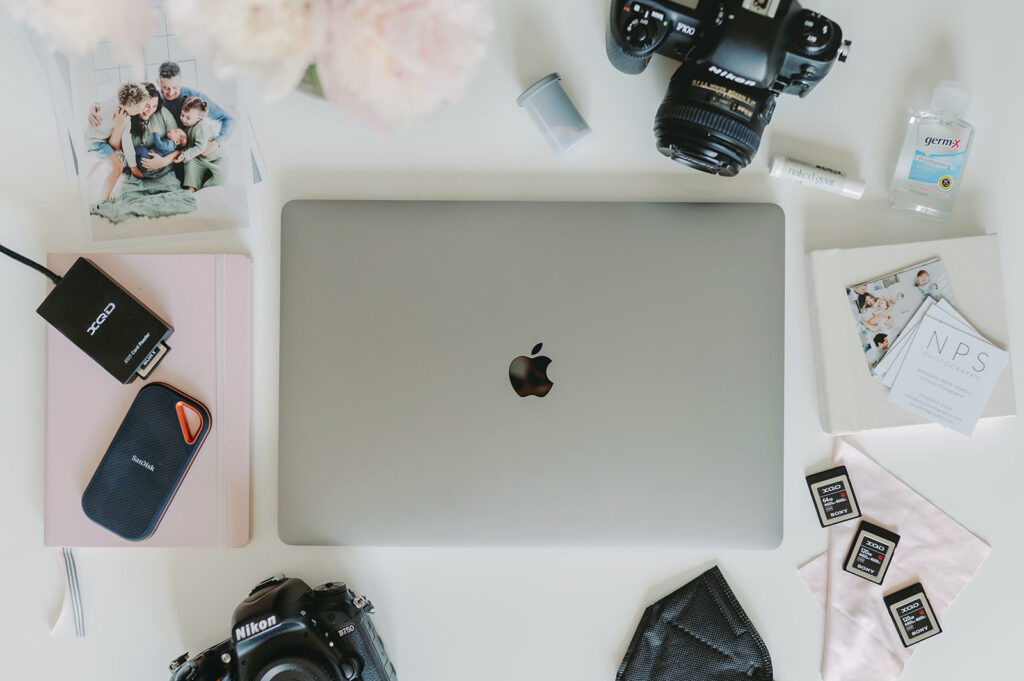 4 Powerful Ways to Improve Client Experience This Spring! - NPS Photography photographers computer set up getting into ways to improve client experience