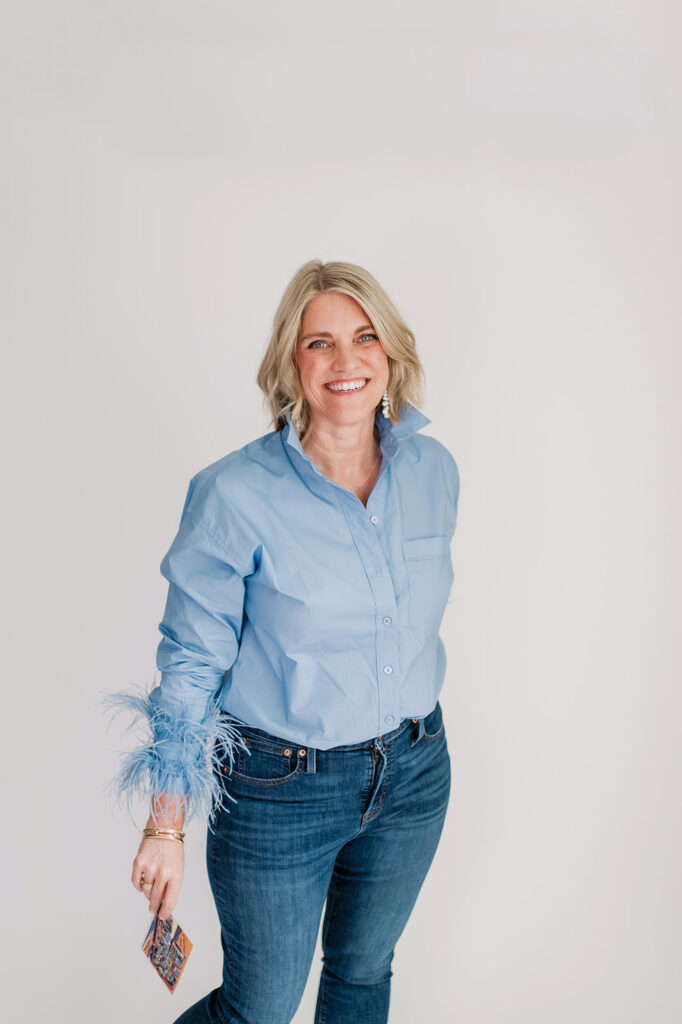 4 Powerful Ways to Improve Client Experience This Spring! - NPS Photography photography coach smiling in a blue outfit ready to chat about ways to improve client experience this spring