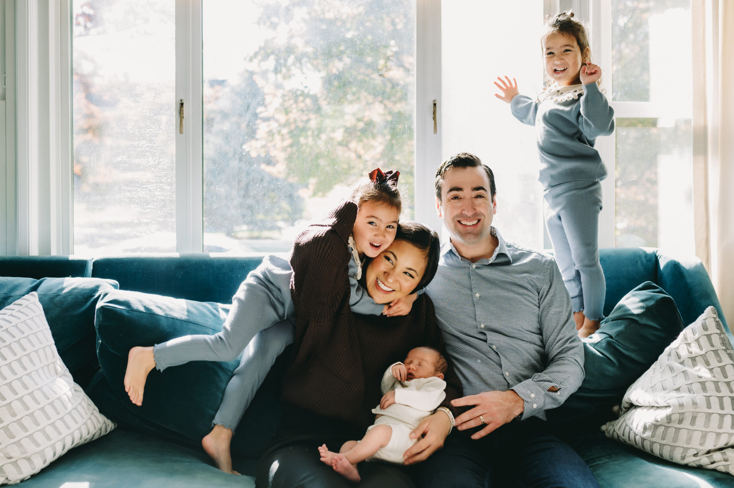 Family Photo Shoot Tips (No Bribes, Just Real Happy Moments) - NPS Photography family of 5 sitting on a couch during a family session