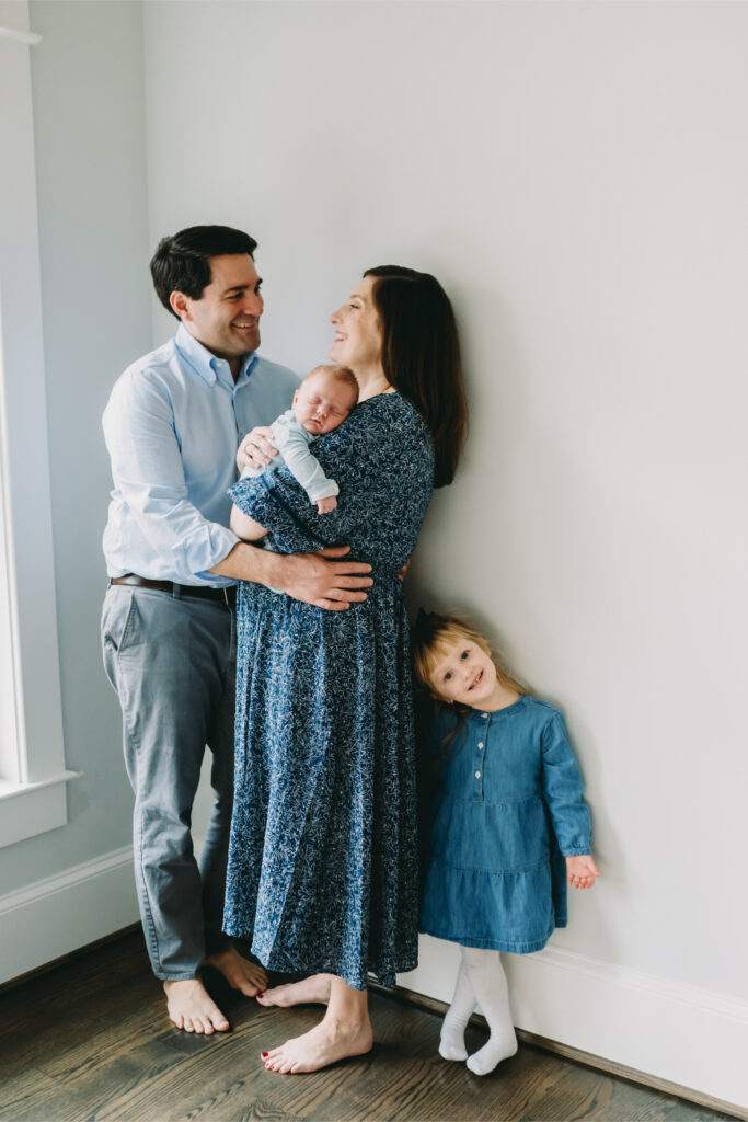 What to Wear for Spring Family Photos (Feel Confident & Camera-Ready) - NPS Photography Gorgeous family posing with new baby-What to Wear for Spring Family Photos (That Won’t Look Dated Next Year)