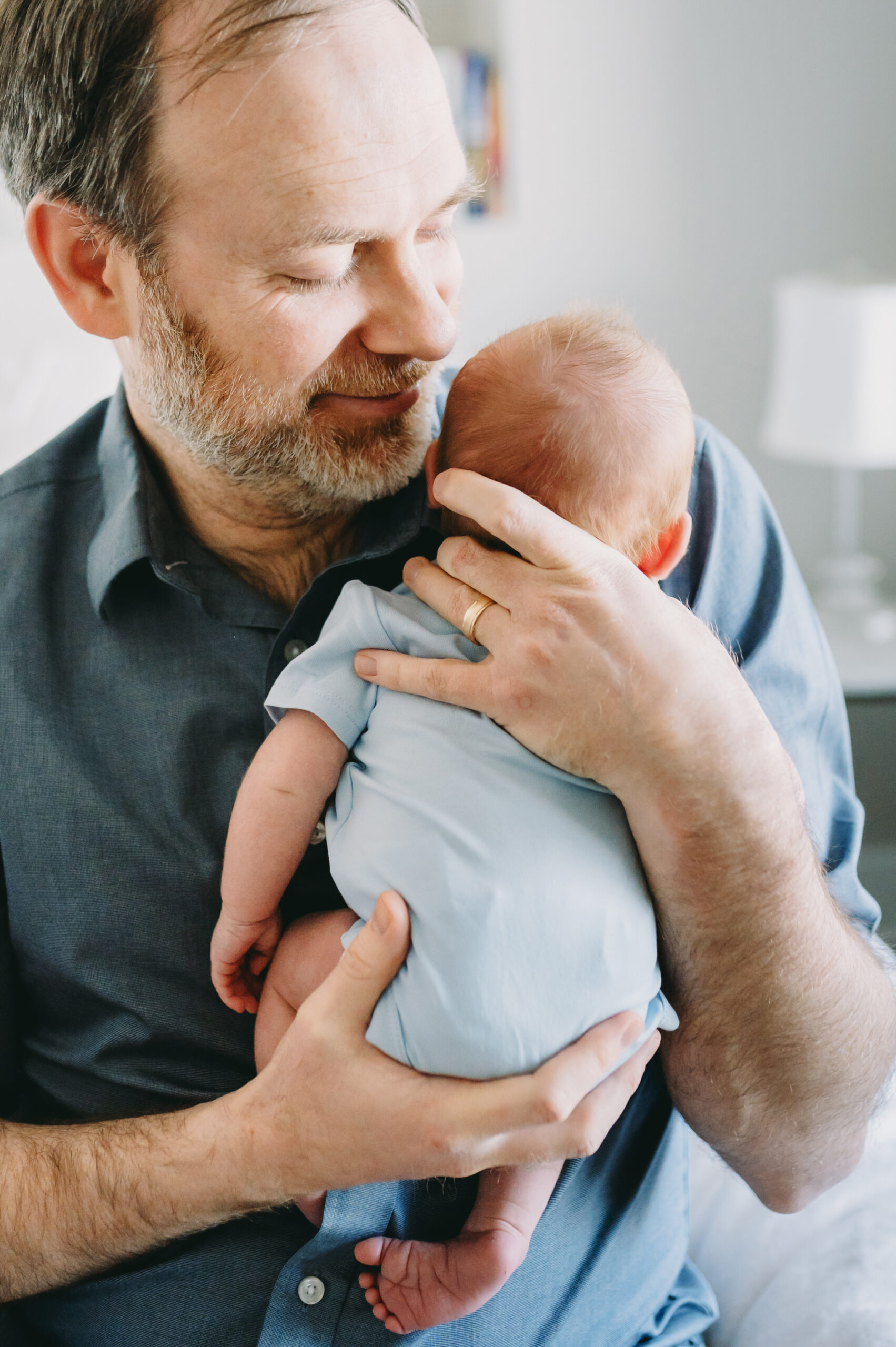 Powerful Session Prep for Photographers: How a 12 Slide PowerPoint Inspired Me - NPS Photography dad holding newborn