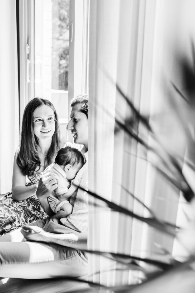 Luxury Family Photographer Pricing: You Are Not Your Client’s Budget Coach - NPS Photography black and white photo of mom, dad and newborn baby Mclean, va