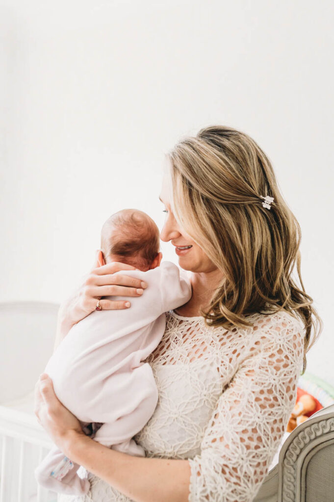 mom holding baby girl