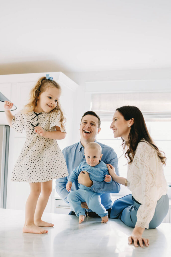 family having a dance party in their kitchen in Alexandria, VA